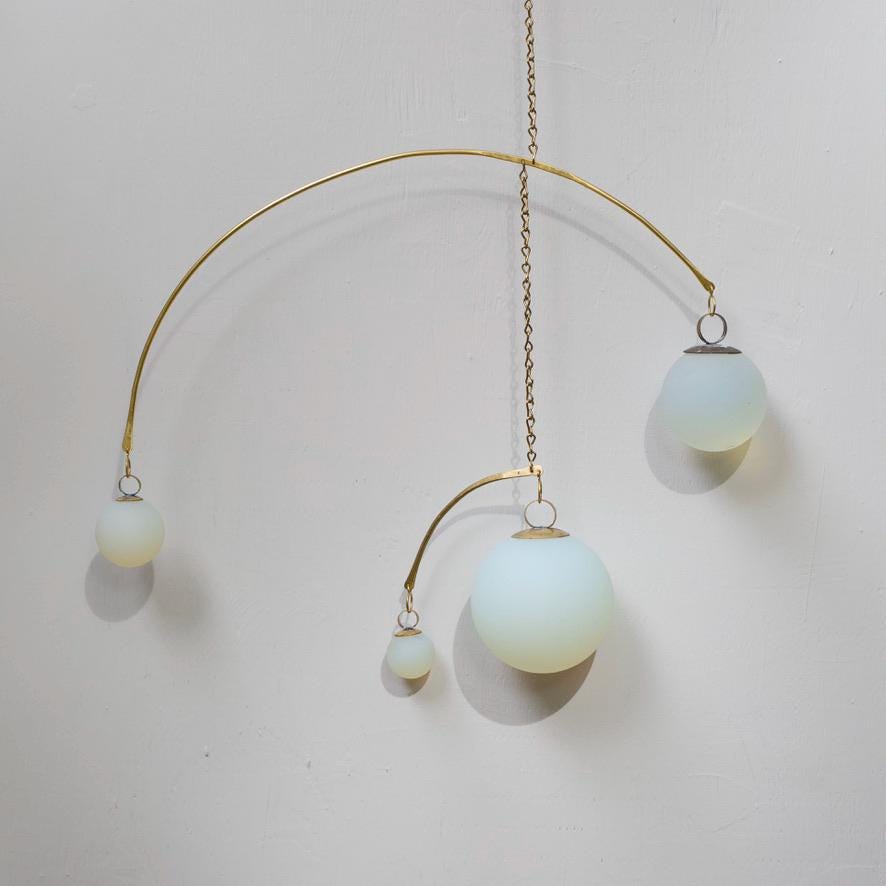Opalite & Brass Kinetic Quattro Mobile