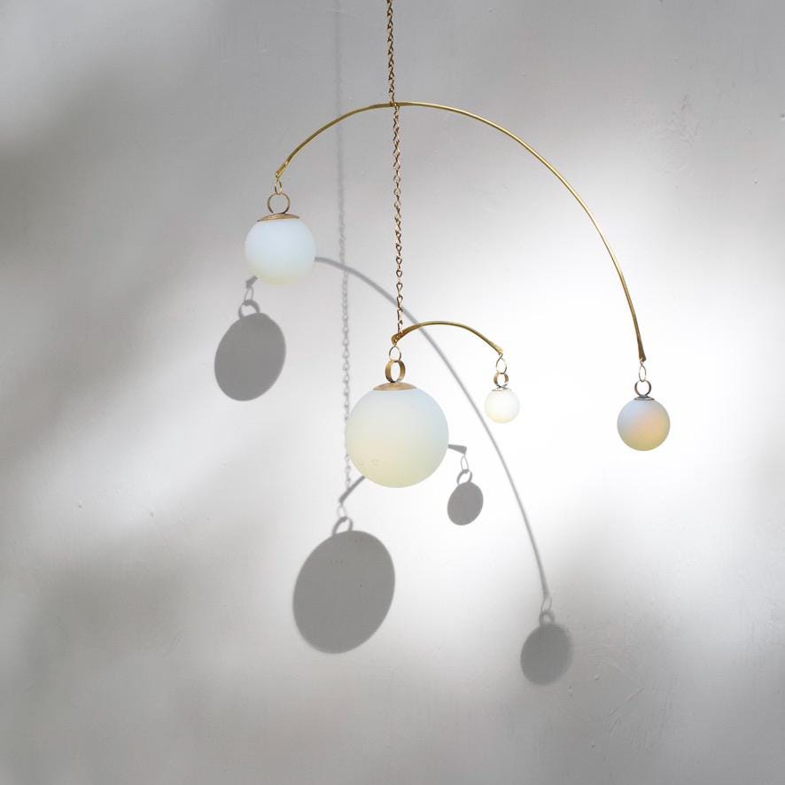 Opalite & Brass Kinetic Quattro Mobile